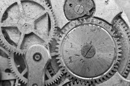 Black and white Metal Cogwheels in Oldest Rusty Clockwork, Macro. Concept Teamwork, Idea Technology