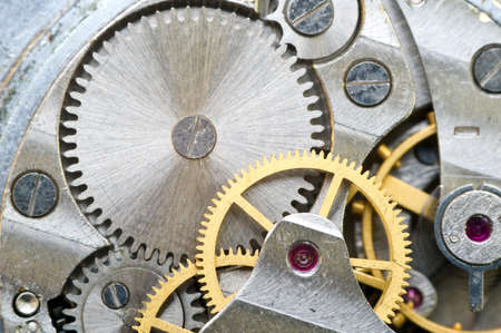Metal cogwheels inside clockwork. Concept Eternity, Teamwork , Idea Technology. Macro.
