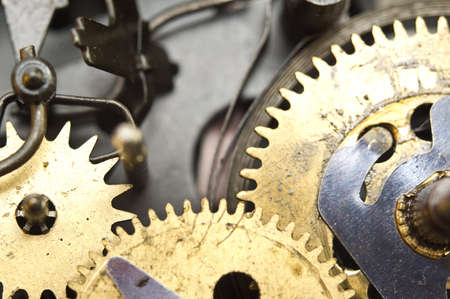 Gearwheels inside clock mechanism. Concept Teamwork , Idea Technology