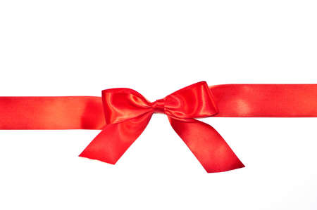 Red bow ribbon with tails isolated on white backgroundの写真素材
