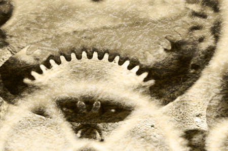 Creative abstract stylized view of old grunge texture of steel gears. Macro. Sepiaの写真素材