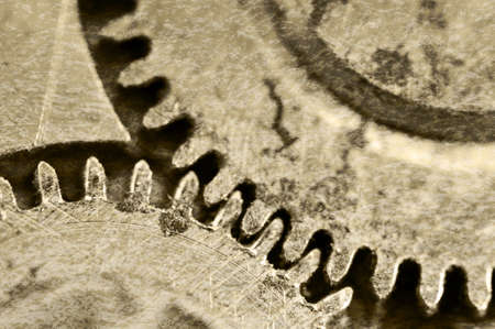  Creative abstract stylized view of old grunge texture of steel gears. Macro. Sepiaの写真素材