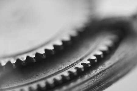 Gear wheels, monochrome industrial background. Very shallow depth of  field, focus is very small. Creative photography for conceptual projects. Macro.の写真素材