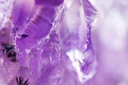 Amethyst natural mineral,  beautiful abstract lilac Macro background. Natural light translucent crystal, extreme close-up.の写真素材