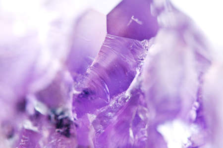 Amethyst natural mineral,  beautiful abstract lilac Macro background. Natural light translucent crystal, extreme close-up.の写真素材