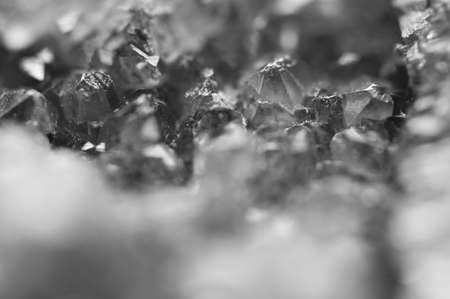 Black and white photograph of the structure of the surface of crystals. Close-up. Blurred backgroundの写真素材