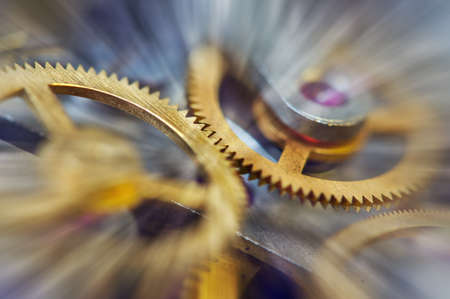 Metal Cogwheels in clock mechanism , abstract sun beams, Concept Movement is life, Teamwork , Idea Technology, Infinity. Macro.の写真素材