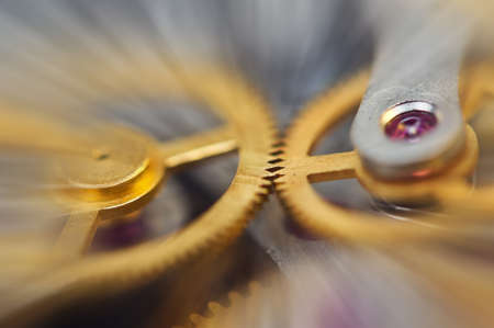 Metal Cogwheels in clock mechanism , abstract sun beams, Concept Movement is life, Teamwork , Idea Technology, Infinity. Macro.の写真素材