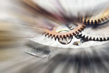 Metal Cogwheels in clock mechanism , abstract sun beams, Concept Movement is life, Teamwork , Idea Technology, Infinity. Macro.の写真素材