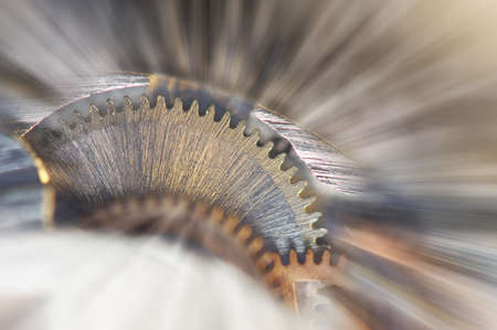 Metal Cogwheels in clock mechanism , abstract sun beams, Concept Movement is life, Teamwork , Idea Technology, Infinity. Macro.の写真素材