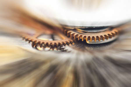 Metal Cogwheels in clock mechanism , abstract sun beams, Concept Movement is life, Teamwork , Idea Technology, Infinity. Macro.の写真素材