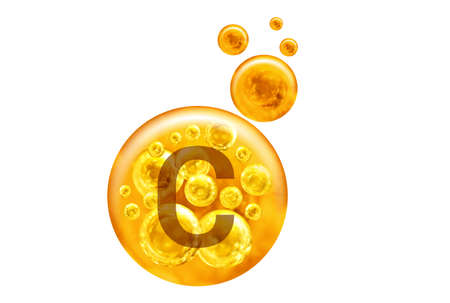 Vitamin C capsule. Golden balls with bubbles isolated on white background. Healthy lifestyle concept.の写真素材