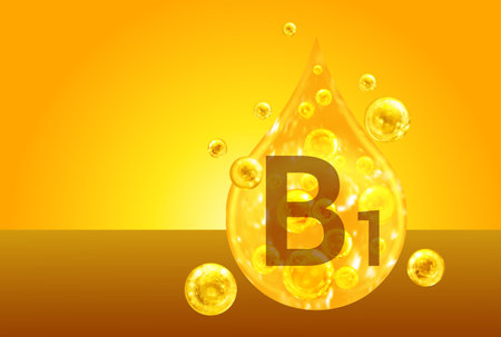 Vitamin B1. Golden drops with oxygen bubbles. health conceptの写真素材