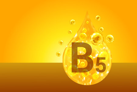 Vitamin B5. Golden drops with oxygen bubbles. health conceptの写真素材