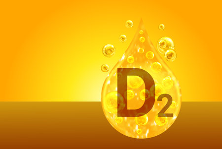 Vitamin D2. Golden drops with oxygen bubbles. health conceptの写真素材