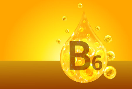 Vitamin B6. Golden drops with oxygen bubbles. health conceptの写真素材