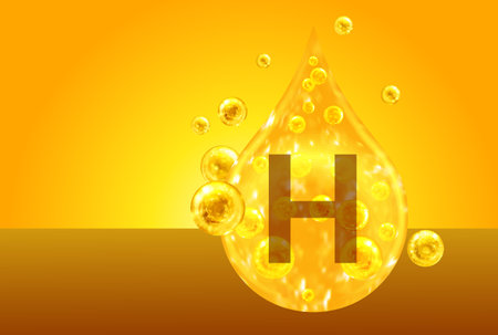 Vitamin H. Golden drops with oxygen bubbles. health conceptの写真素材