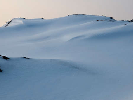 winter landscape, mountain slopes covered with untouched snowの写真素材