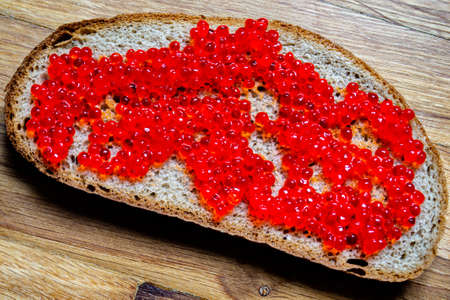 homemade bread with red caviarの写真素材