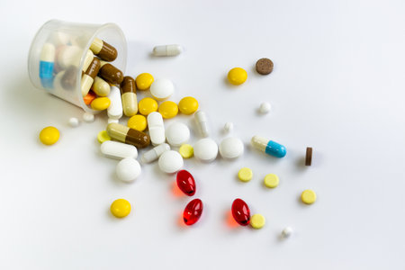 multicolored pills on a white table