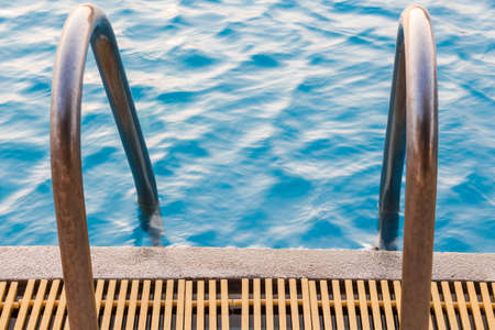 swimming pool with sunny reflectionsの写真素材