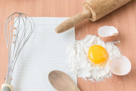 Ingredients for baking cake with egg on a wooden worktop - Rustic background with free text spaceの写真素材