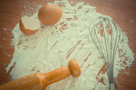 baking cake with egg background -vintage retro style color effectの写真素材