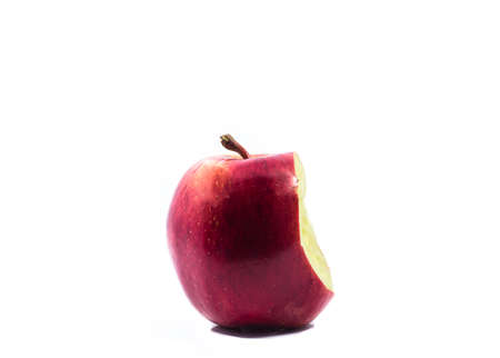 Red apple with a bite mark, isolated on white backgroundの写真素材