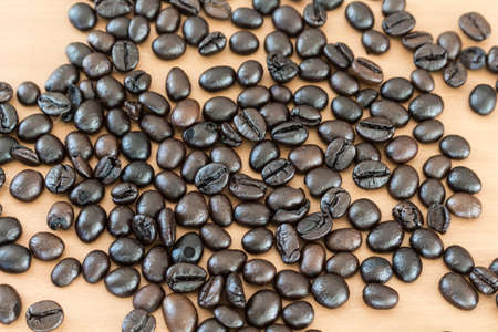 coffee beans on the wood texture backgroundの写真素材