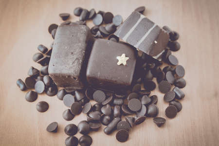 chocolate sweets on wooden - vintage  style color effectの写真素材