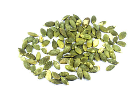Roasted pumpkin seeds isolated on white backgroundの写真素材