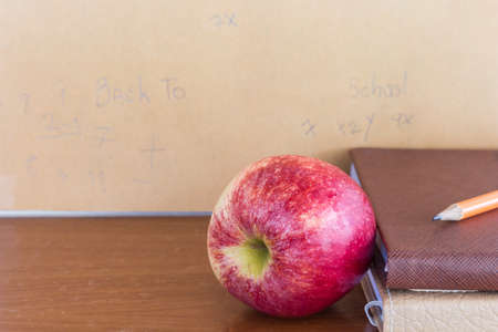 Red apple and book - Concept of educationの写真素材