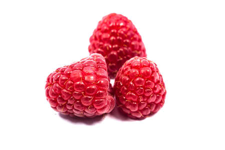 Close up raspberries isolated on white background