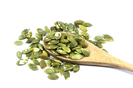 Roasted pumpkin seeds isolated on white backgroundの写真素材