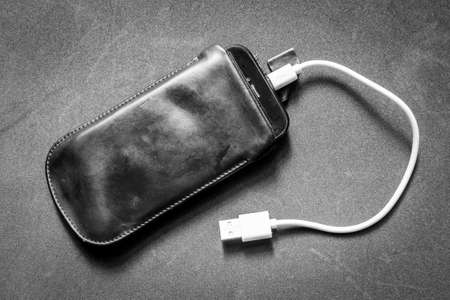 Smartphone with chargerの写真素材