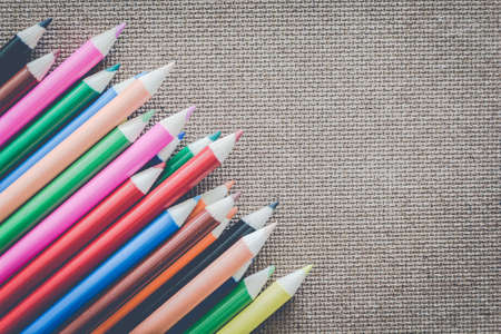 Colour pencils on wooden board - empty space for textの写真素材