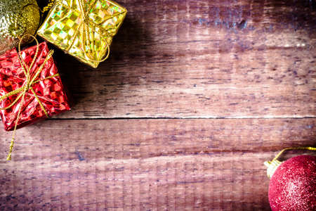 Christmas baubles red and gold  on wood tableの写真素材