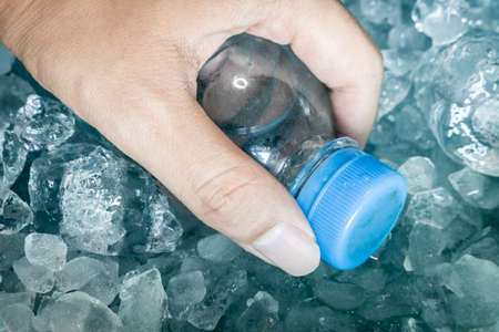 Water bottle in blue ice cubeの写真素材