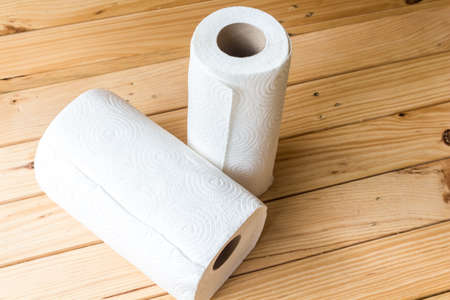 Roll of paper towel on wooden backgroundの写真素材