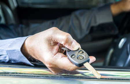 Hand giving a car keyのeditorial素材