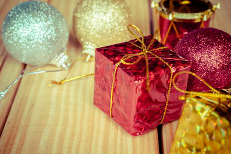 Christmas baubles red gold silver on wood tableの写真素材