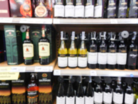 Wine Liquor bottle on shelf, Blurred backgroundの写真素材
