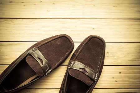 Canvas shoes on wooden floor backgroundの写真素材