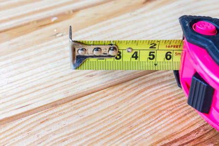 Tape measure on wooden tableの写真素材