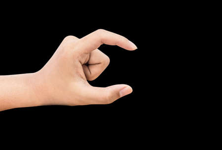 Hand acting on black backgroundの写真素材