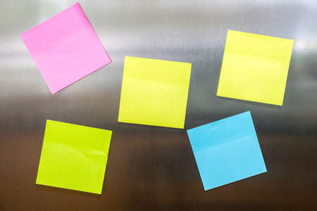 Reminder sticky note on refrigerator doorの写真素材