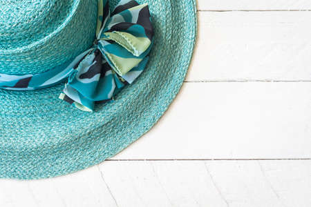 Summer hat on white wooden backgroundの写真素材