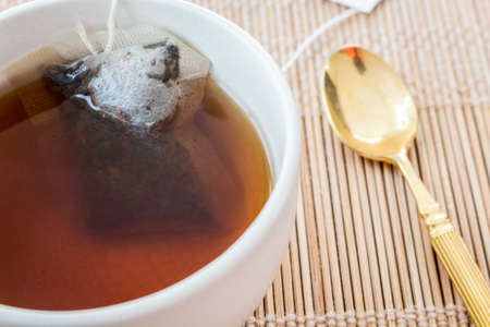 Cup of tea with tea bagの写真素材