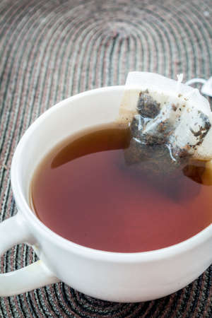 Cup of tea with tea bagの写真素材