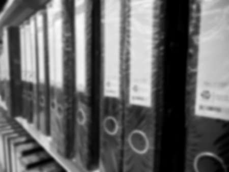 Shelf in a office with many files blur backgroundの写真素材